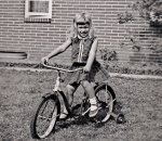 On my first bicycle, age four.  Watch out for Super-Environmentalist!