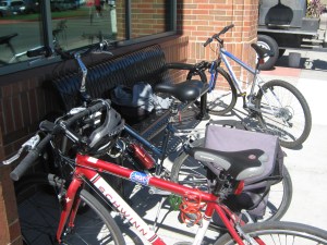 Locking our bikes to the bench and Hy-Vee.
