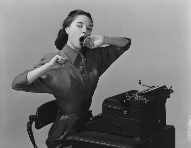 woman yawning at typewriter 1551_2