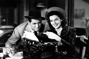 Cary Grant and Rosalind Russell work together on a story in "His Girl Friday."