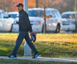 President Barack Obama carries a pair of sneakers as he arrives for a private game of basketball at Fort McNair in Washington, Tuesday, Nov. 8, 2016. Playing basketball on election day is a tradition for Obama. (AP Photo/Pablo Martinez Monsivais) ORG XMIT: DCPM107